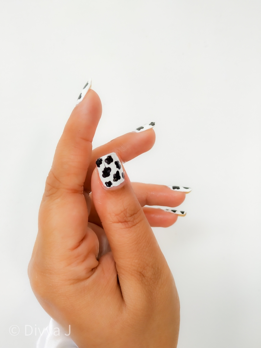 Dalmatian or Cow print nail art